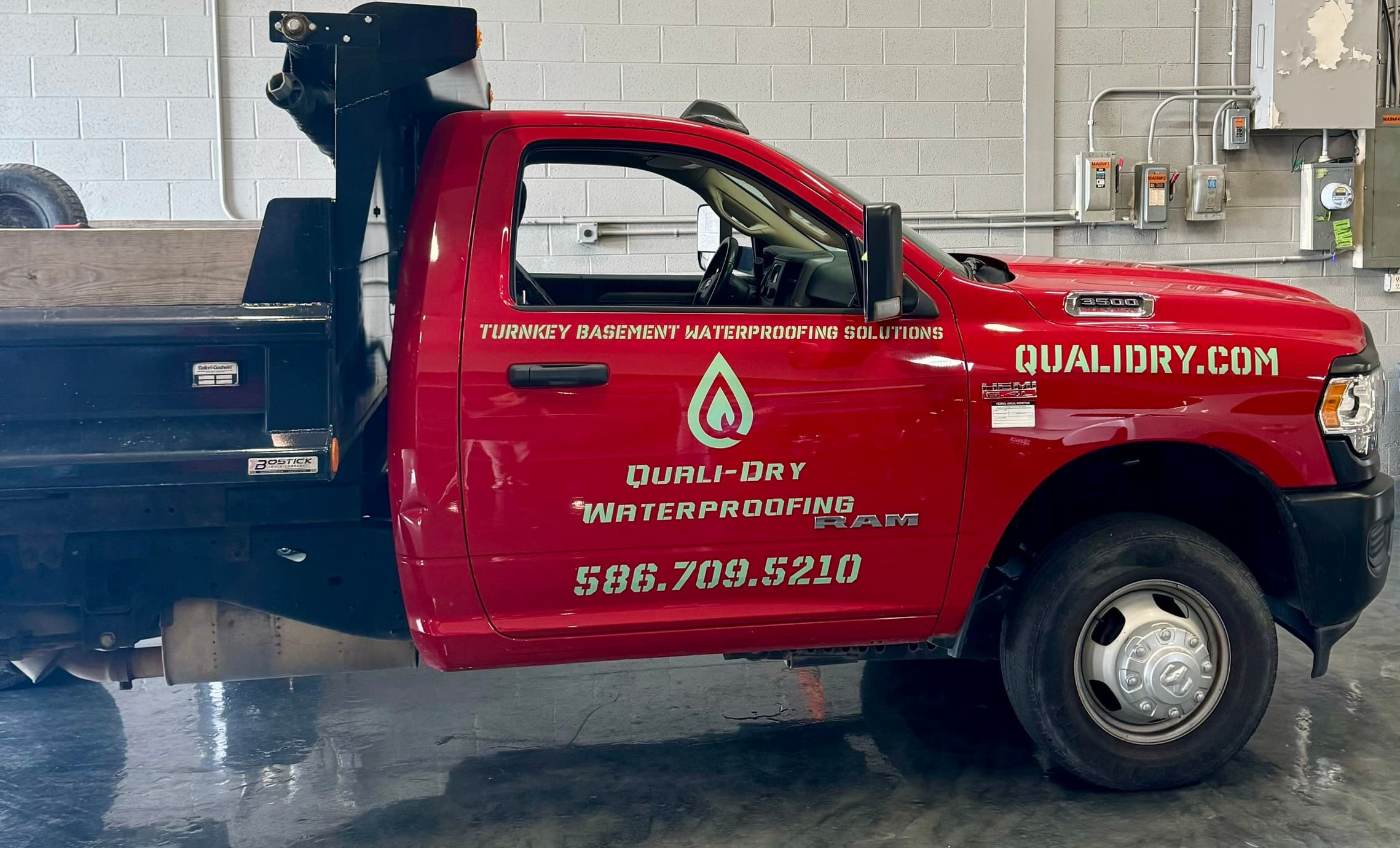 Quali-Dry Waterproofing branded service truck