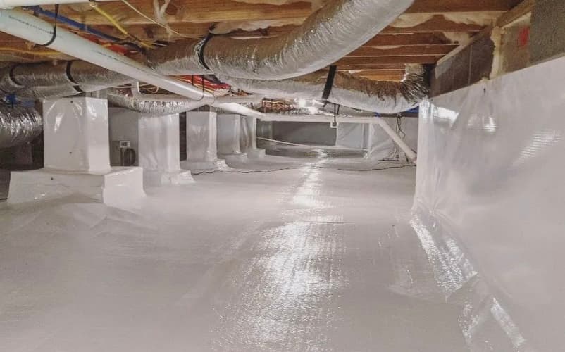 Quali-Dry crawl space encapsulation with white reinforced vapor barrier on floor and walls